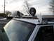 1994 Jeep Cherokee - Off-road accessories including lights and a snorkel are mounted on the roof rack of a white SUV.