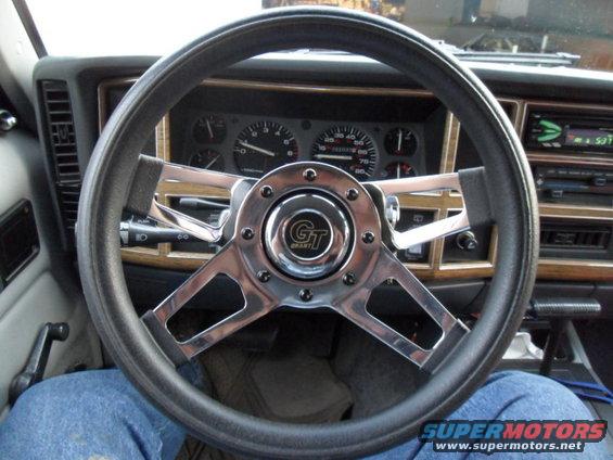 1994 Jeep Cherokee interior with aftermarket Grant steering wheel and wood trim dashboard