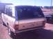 1991 Land Rover Range Rover - The rear of a beige 1991 Land Rover Range Rover is visible with a license plate reading Y88 9LB.
