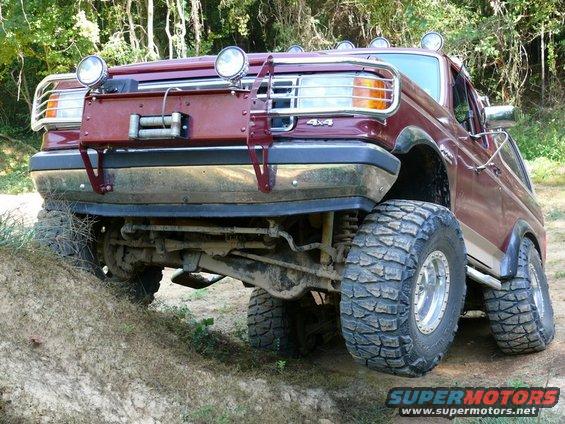 Maroon off-road SUV with winch and brush guard, 4x4 badge visible