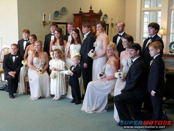 Wedding party posing for a photo indoors
