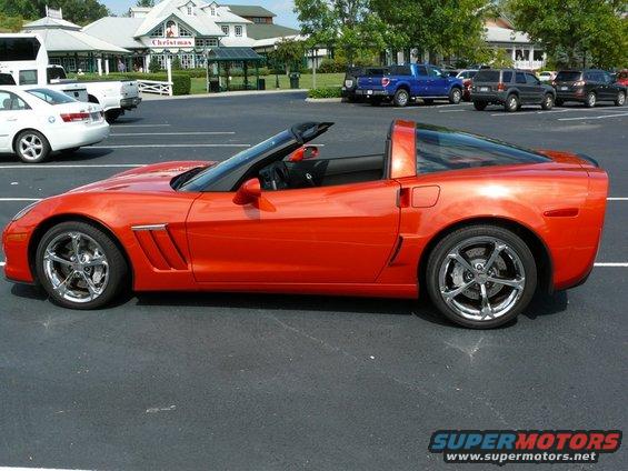 Orange convertible sports car, side view