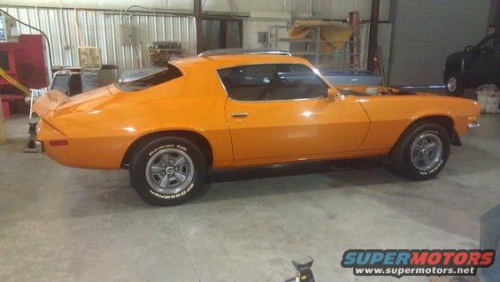 Orange 1973 Chevrolet Camaro, side view. BFGoodrich Radial T/A tires