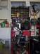 1977 Ford Mustang II - Garage scene with welding equipment, storage shelves, and a sink area.