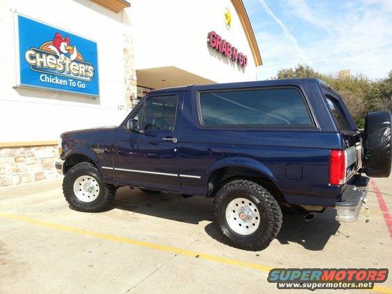 Blue 1995 Ford Bronco parked in front of Chester's Chicken To Go
