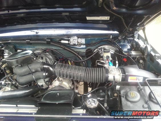 Engine bay of a 1995 Ford Bronco, showing the air intake and engine components