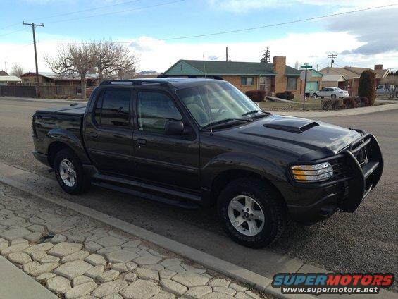 2005 Ford Sport Trac parked on street, front quarter view
