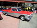 1973 Ford Ranchero - A two-tone red and silver 1957 Ford Ranchero is parked at an outdoor event.