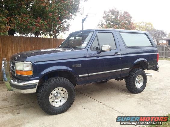 Blue 1995 Ford Bronco parked on a driveway