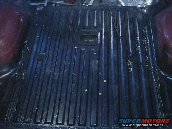 Interior cargo area with ribbed floor and markings