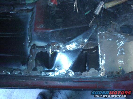 Floor pan rust repair with new metal patch welded in place