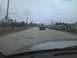 2003 Ford Crown Victoria - Driving on a road with a city skyline in the distance and other vehicles ahead.