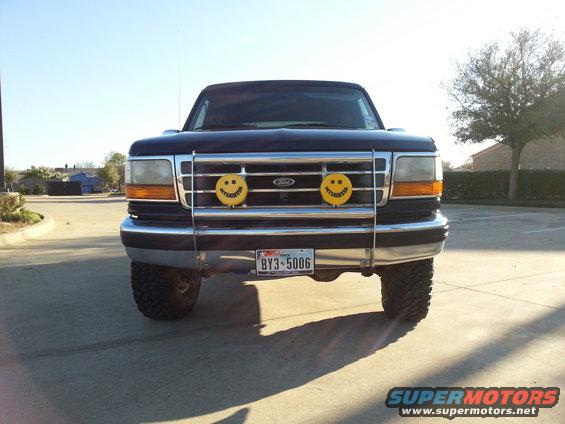 1995 Ford Bronco front view with smiley face lights and Texas license plate BY3-5006