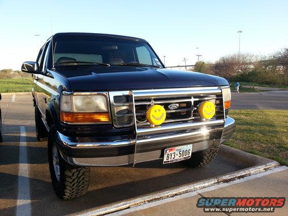 1995 Ford Bronco front view with yellow smiley face fog lights and aftermarket bumper