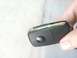 1997 Ford Taurus - A person is holding a modern Ford key fob, which is a part of a vehicle's ignition system.