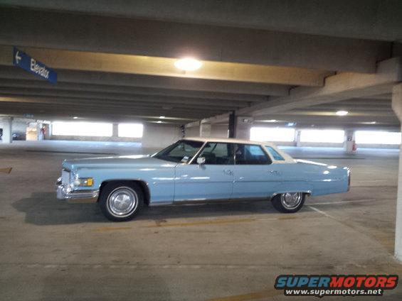 Light blue 1974 Cadillac Sedan de Ville parked in a parking garage