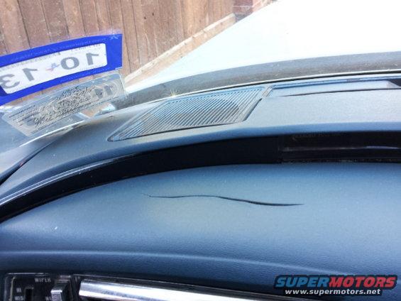 dashboard with cracks and a license plate frame