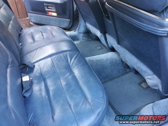 Blue leather rear seats and carpeted floor