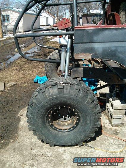 Custom off-road buggy frame with large tires and suspension components visible