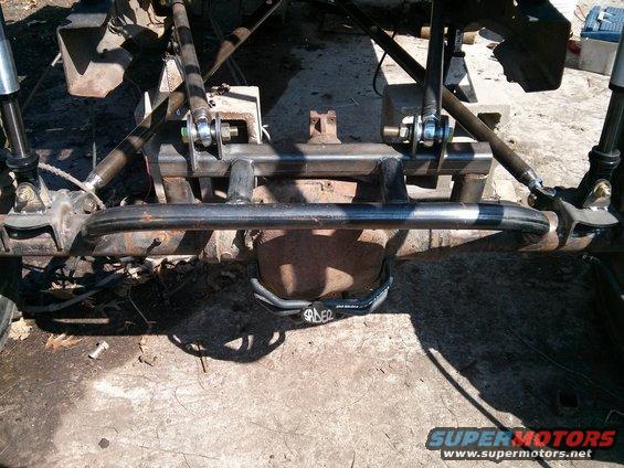 Custom suspension links and shocks attached to a vehicle's rear axle assembly