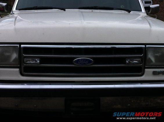 White 1990 Ford F-150 front grille with Ford logo