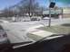 2003 Ford Crown Victoria - Several vehicles are visible at a street intersection with a 7-Eleven store in the background.