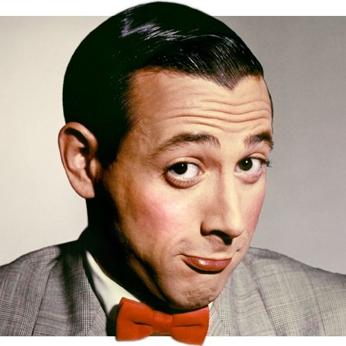 Man with slicked black hair, wearing a grey suit and red bowtie, looking towards the camera