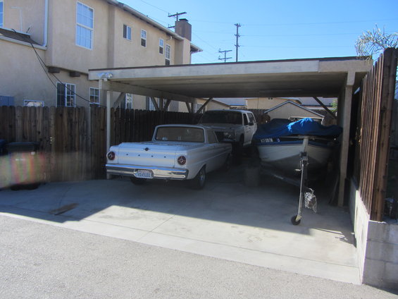 White 1963 Ford Falcon rear view with license plate visible