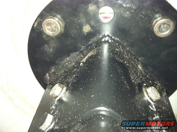 Black metal bracket with bolts and Supermotors.net watermark