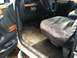 1992 Ford C-350 (Centurion Conversions) - The interior of a 1992 Ford C-350 (Centurion Conversions) shows signs of wear and tear, with diamond plate floor mats and wood trim accents.