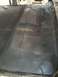 1992 Ford C-350 (Centurion Conversions) - Interior floor of a vehicle, showing metal with some texture and a seam.