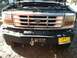 1992 Ford C-350 (Centurion Conversions) - Front view of a 1992 Ford C-350 (Centurion Conversions) with its hood open, showing the grille, bumper, and winch.