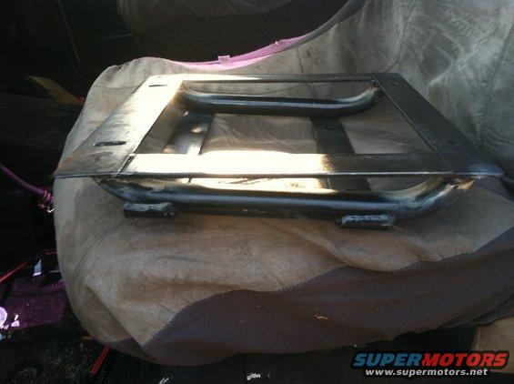 Metal seat frame on a blanket inside a vehicle