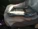 1992 Ford C-350 (Centurion Conversions) - A metal seat frame rests on a blanket, likely inside a vehicle's interior.
