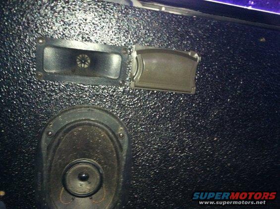 Interior door panel with speaker and handle