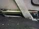1992 Ford C-350 (Centurion Conversions) - Interior view of seat mounting hardware and carpet, with visible wiring.