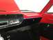 1964 Ford Fairlane - The interior of a 1964 Ford Fairlane shows a red dashboard with black accents and a Pioneer radio.