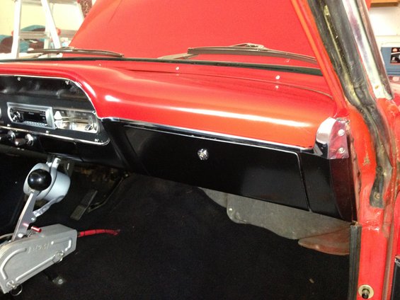 1964 Ford Fairlane interior with red dashboard and black accents