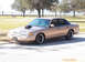 1993 Ford Crown Victoria - This 1993 Ford Crown Victoria has a prominent hood scoop and custom wheels.