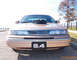 1993 Ford Crown Victoria - This modified Ford Crown Victoria features a prominent engine intake and a custom license plate indicating '5.4'.