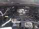 2004 Dodge 1500 - The engine bay of a 2004 Dodge 1500, with visible components like the throttle body and alternator.