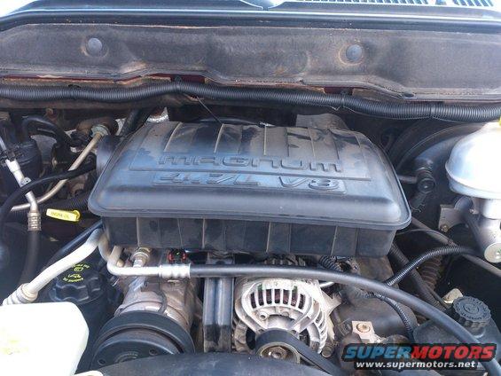 Engine bay view of a 2004 Dodge 1500 with a Magnum 4.7L V8 engine cover