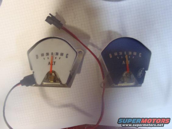 Two automotive gauges, one white and one blue, with red needles pointing to 'ALT'