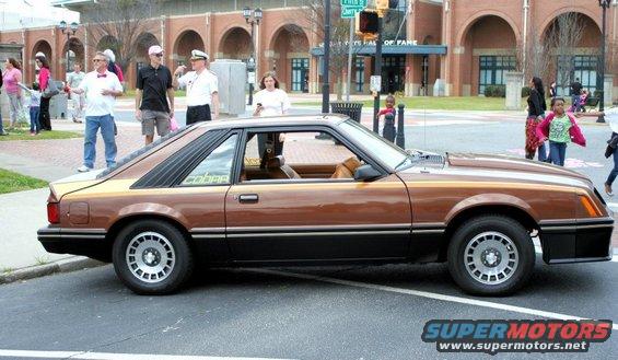 1980 Ford Mustang Cobra coupe, brown and gold two-tone paint, side view