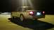 2008 Mercury Grand Marquis - A silver sedan is parked outdoors at night, showing its rear profile with illuminated taillights.