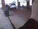 2003 Ford Crown Victoria - A white SUV is parked at a gas station with the driver's door open.