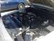 2005 Ford Crown Victoria - Engine bay of a 2005 Ford Crown Victoria a prominent supercharger and aftermarket air intake.