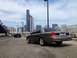2005 Ford Crown Victoria - Rear view of a 2005 Ford Crown Victoria parked in an urban setting with a city skyline.