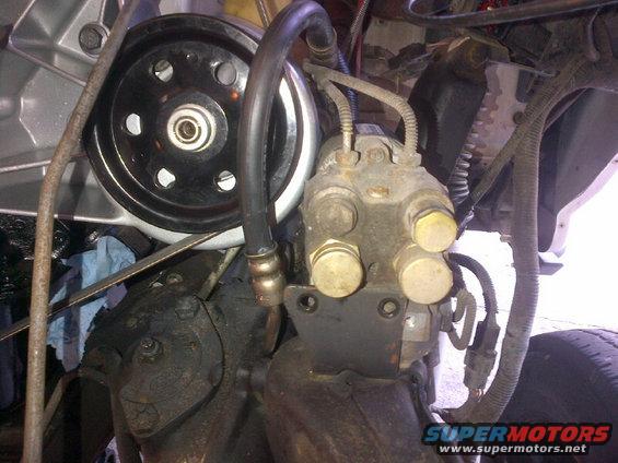 Engine components including a power steering pump and pulley