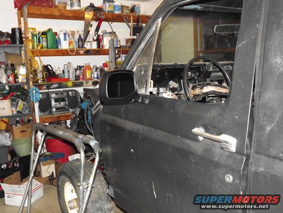 Black 1981 Ford Bronco side view showing door and interior